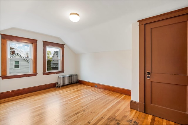 30 Munroe St, Bangor, ME 04401 - bonus room with radiator, lofted ceiling, light wood-style floors, and baseboards