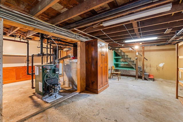 30 Munroe St, Bangor, ME 04401 - unfinished below grade area with a heating unit and stairs