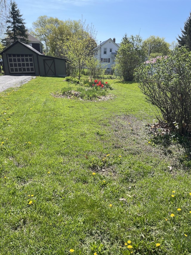 30 Munroe St, Bangor, ME 04401 - view of grassy yard featuring a garage and an outdoor structure