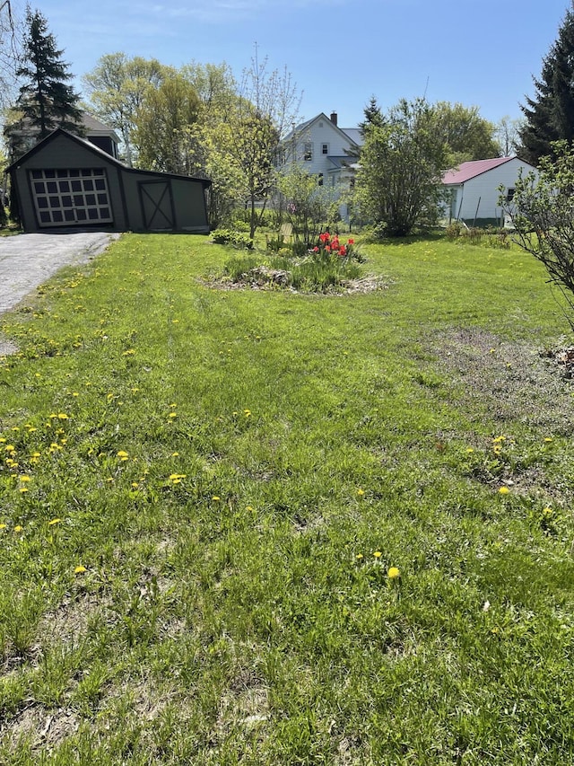 30 Munroe St, Bangor, ME 04401 - view of grassy yard featuring a garage