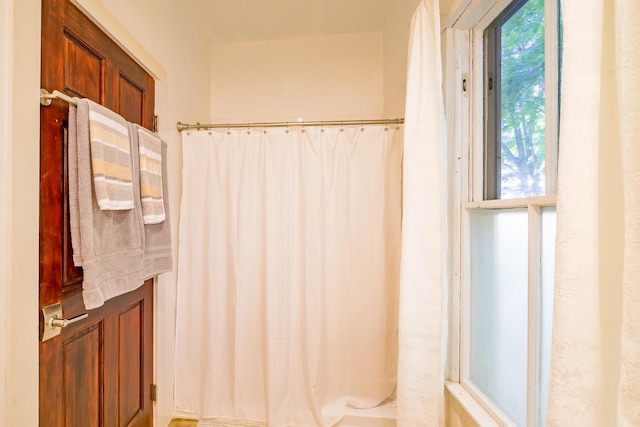 bathroom with a shower with shower curtain