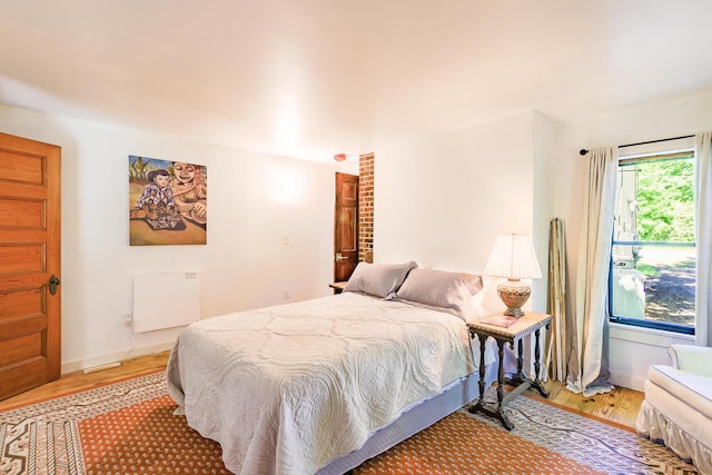 bedroom with light wood finished floors