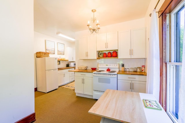 kitchen featuring tasteful backsplash, a chandelier, butcher block counters, and white appliances
