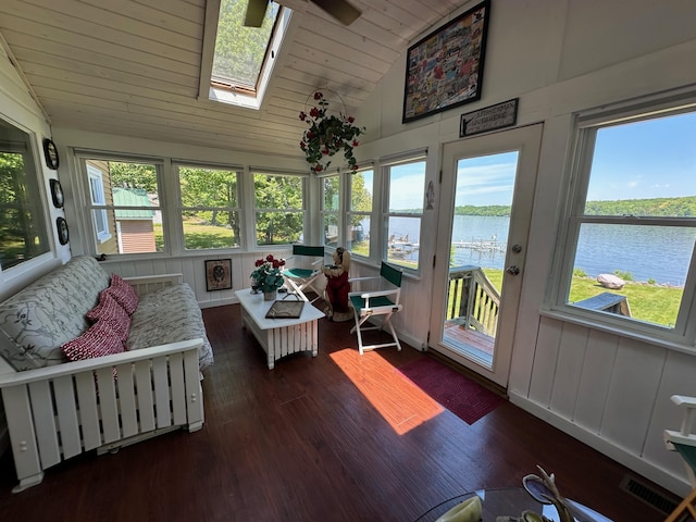 sunroom / solarium with visible vents, a skylight, a healthy amount of sunlight, and a water view