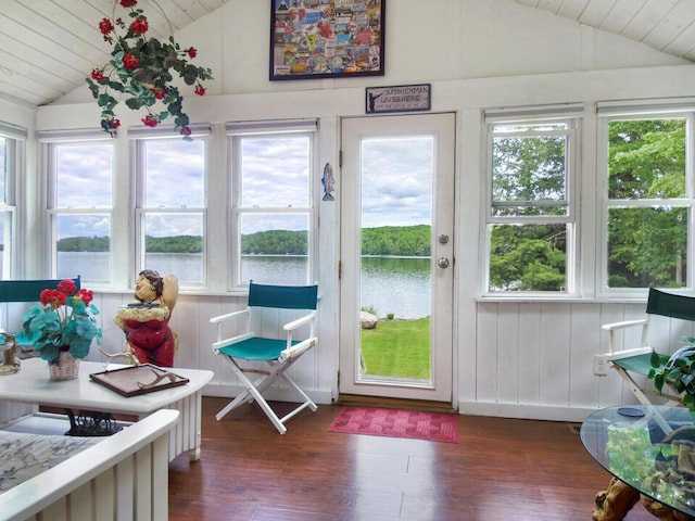 sunroom / solarium featuring wood ceiling, wood finished floors, a water view, and vaulted ceiling