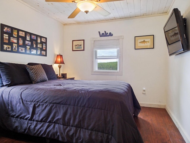 bedroom with baseboards, wood finished floors, ceiling fan, and wood ceiling