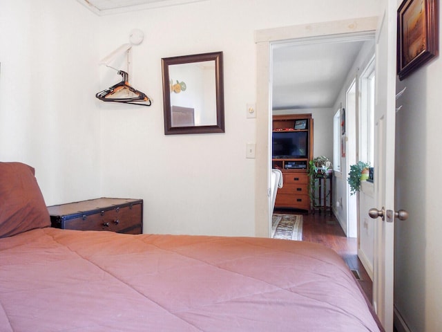 bedroom featuring wood finished floors