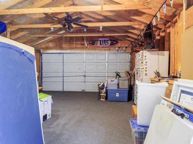 garage with ceiling fan and freestanding refrigerator