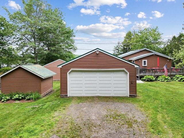 detached garage with dirt driveway
