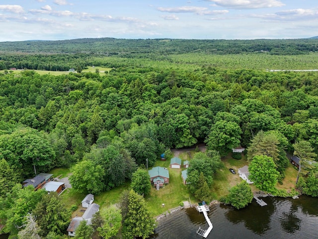 aerial view with a wooded view and a water view
