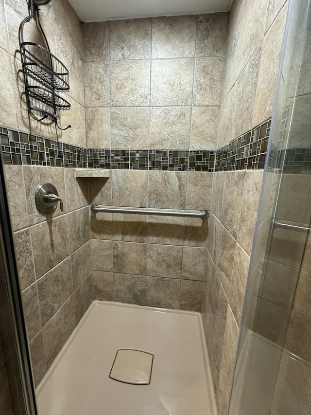 bathroom featuring a shower stall