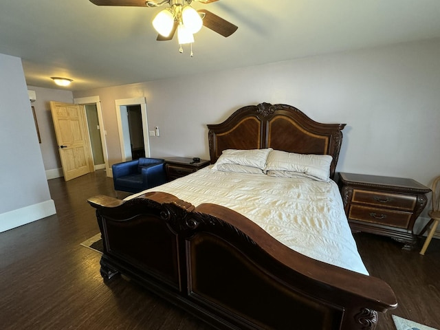 bedroom featuring wood finished floors, a ceiling fan, and baseboards