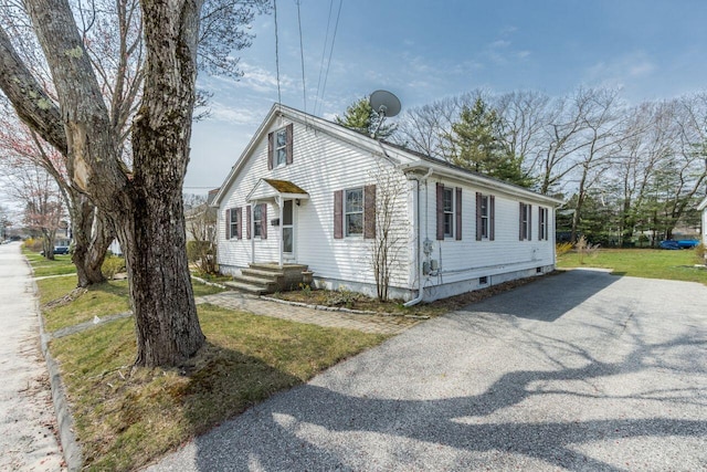 59 Brigham St, South Portland, ME 04106 - view of front of home with a front lawn and aphalt driveway