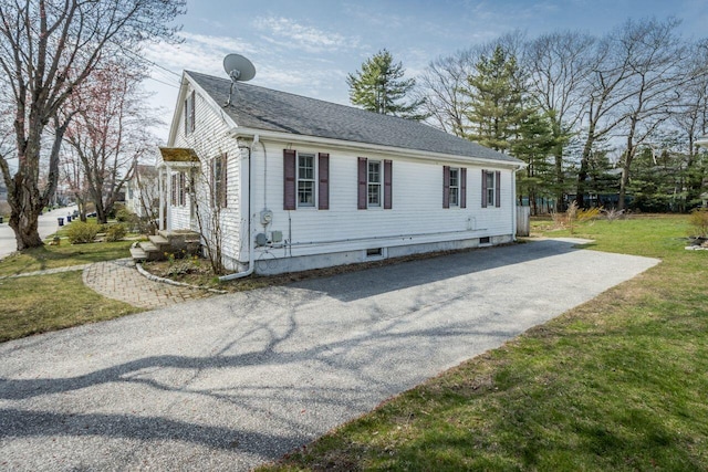 59 Brigham St, South Portland, ME 04106 - view of property exterior with a lawn, a shingled roof, and aphalt driveway