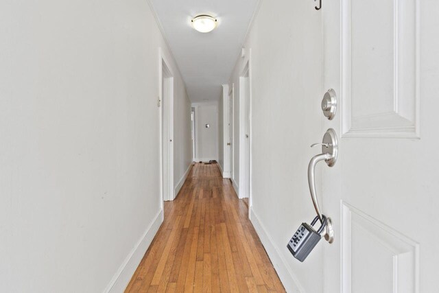 59 Brigham St, South Portland, ME 04106 - corridor with light wood finished floors and baseboards