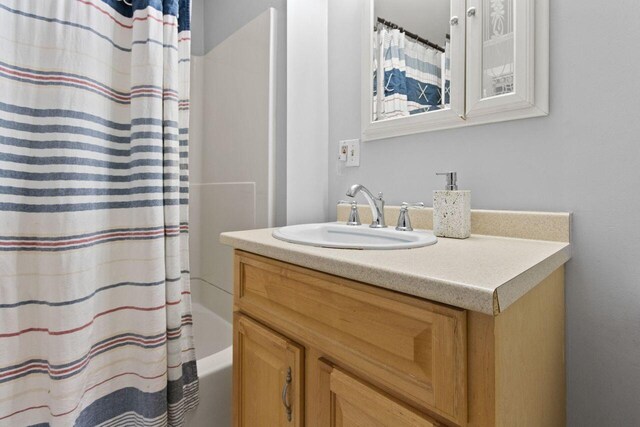59 Brigham St, South Portland, ME 04106 - bathroom featuring shower / bath combo and vanity
