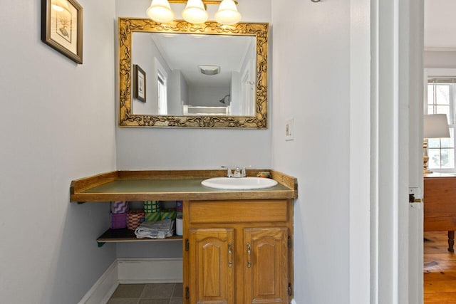 59 Brigham St, South Portland, ME 04106 - bathroom with baseboards and vanity