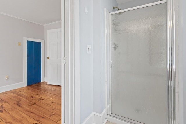 59 Brigham St, South Portland, ME 04106 - full bath with ornamental molding, a stall shower, wood finished floors, and baseboards