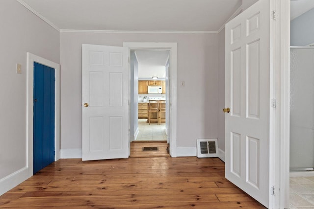 59 Brigham St, South Portland, ME 04106 - unfurnished bedroom with visible vents, hardwood / wood-style flooring, and ornamental molding