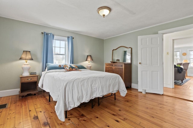 59 Brigham St, South Portland, ME 04106 - bedroom featuring visible vents, baseboards, light wood finished floors, and multiple windows