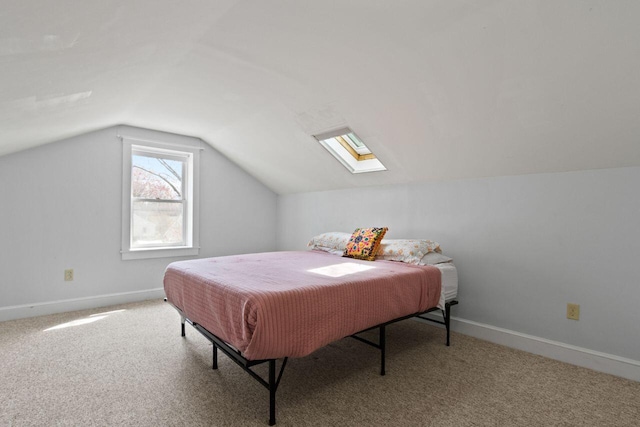 59 Brigham St, South Portland, ME 04106 - bedroom featuring baseboards, carpet flooring, and vaulted ceiling with skylight