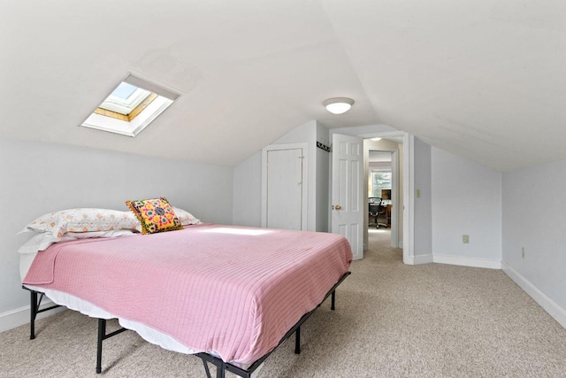 59 Brigham St, South Portland, ME 04106 - bedroom with light colored carpet, baseboards, and vaulted ceiling with skylight