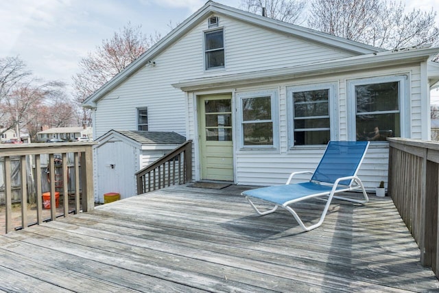 59 Brigham St, South Portland, ME 04106 - wooden terrace featuring a storage unit and an outbuilding