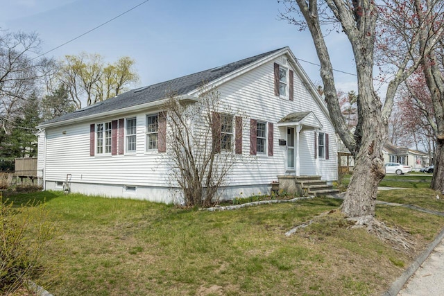 59 Brigham St, South Portland, ME 04106 - view of side of home featuring a yard