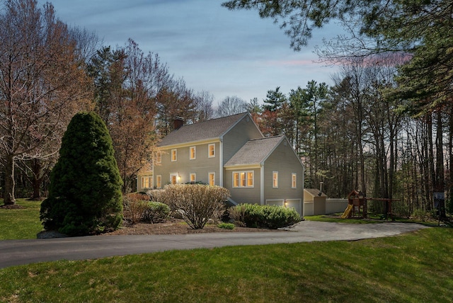 19 Windsor Pines Dr, Scarborough, ME 04074 - view of front of house with an attached garage, driveway, a yard, and a chimney