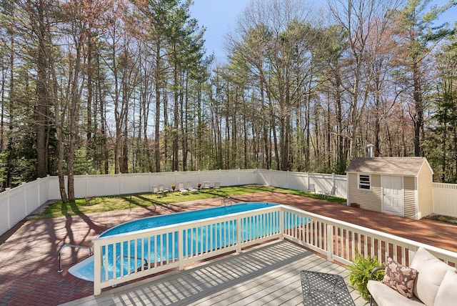 19 Windsor Pines Dr, Scarborough, ME 04074 - view of pool featuring a fenced backyard, a storage shed, and an outdoor structure