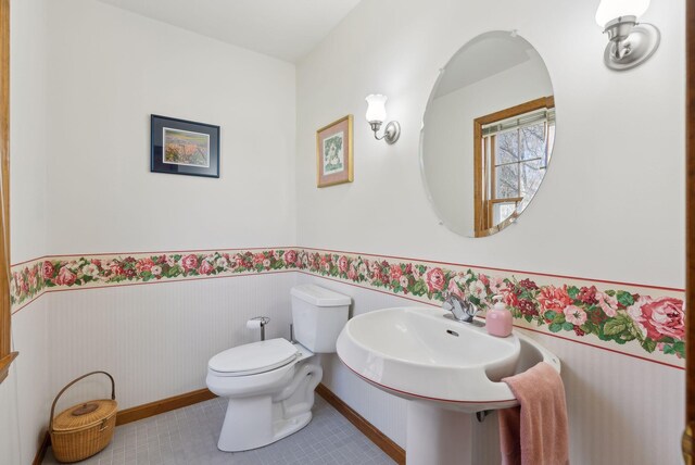 19 Windsor Pines Dr, Scarborough, ME 04074 - half bathroom with wainscoting, toilet, tile patterned flooring, and baseboards