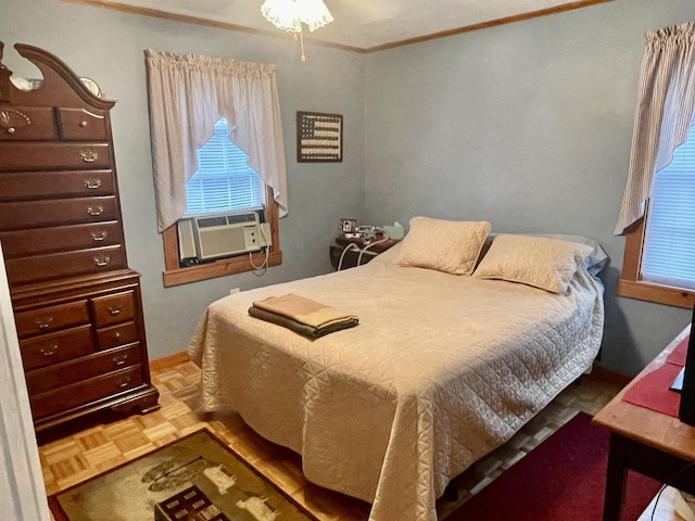 bedroom featuring crown molding, multiple windows, and cooling unit