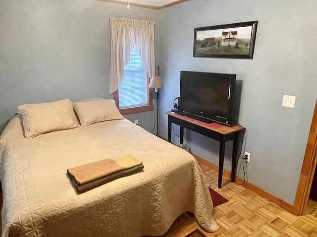 bedroom featuring baseboards