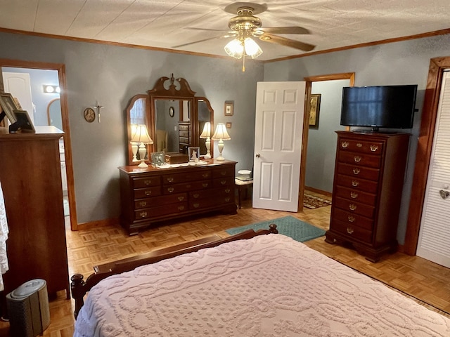 bedroom featuring ceiling fan, baseboards, and ornamental molding