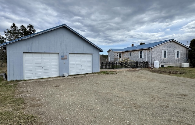 detached garage with fence