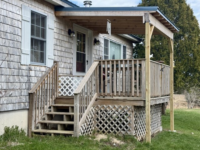 wooden terrace with a lawn