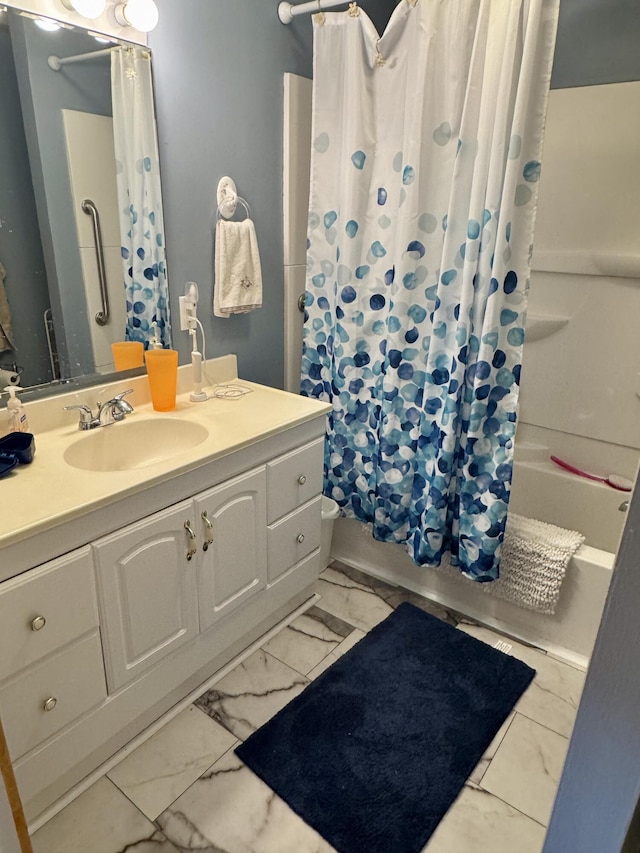 full bathroom featuring shower / tub combo, marble finish floor, and vanity
