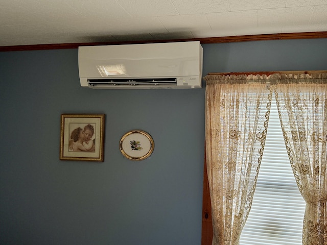 room details with an AC wall unit and ornamental molding