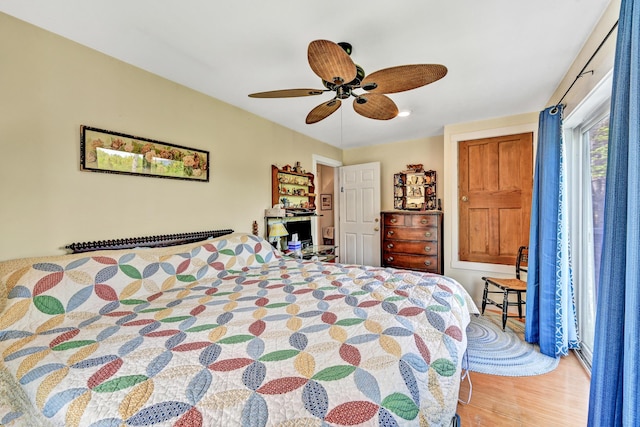 bedroom featuring ceiling fan and wood finished floors