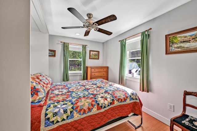 bedroom featuring baseboards, a ceiling fan, recessed lighting, and wood finished floors