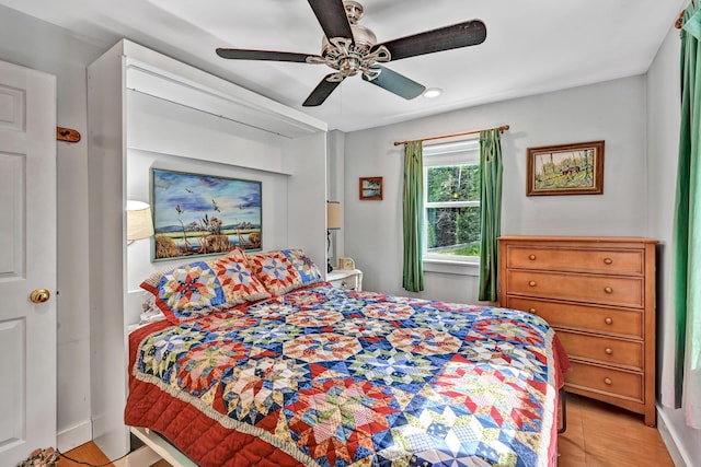 bedroom featuring ceiling fan and wood finished floors