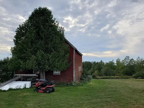 view of home's exterior featuring a lawn