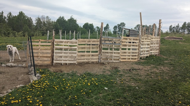 view of gate featuring fence