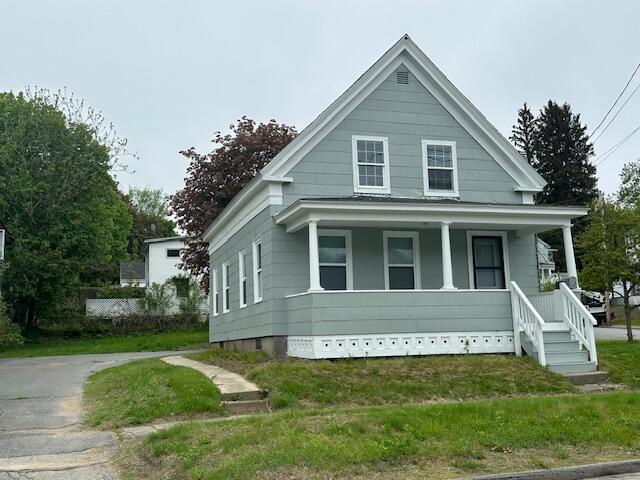 64 Washington St, Augusta, ME 04330 - view of front of home with a porch and a front yard