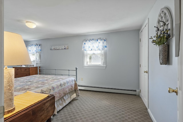 bedroom with carpet floors and baseboard heating
