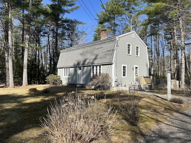7 Kathryn St, Gorham, ME 04038 - view of side of property featuring a gambrel roof and a chimney
