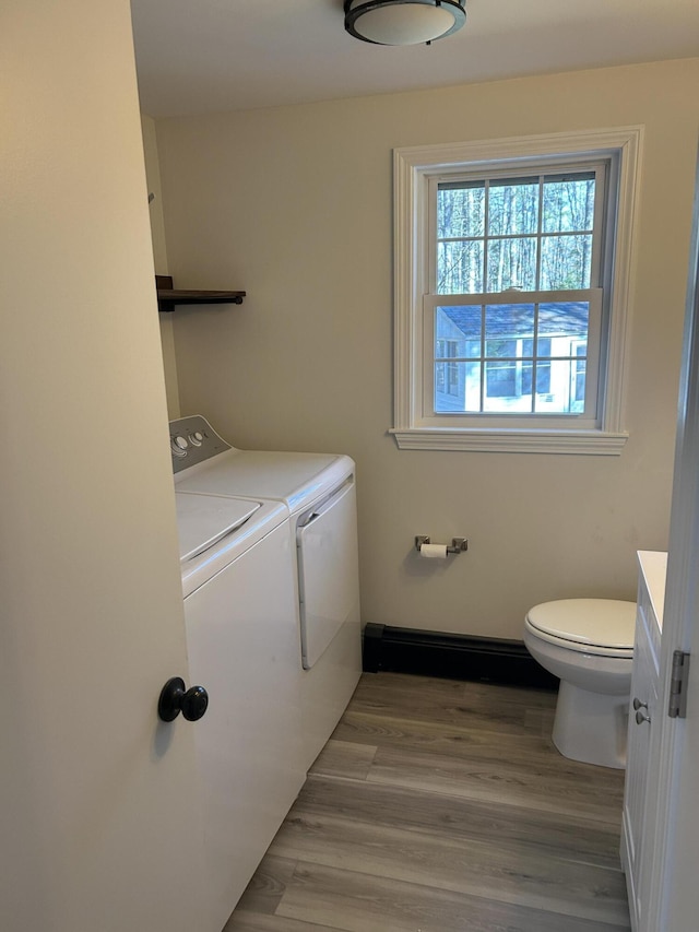 7 Kathryn St, Gorham, ME 04038 - bathroom with washer and dryer, toilet, wood finished floors, and vanity
