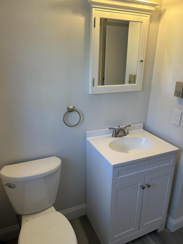 7 Kathryn St, Gorham, ME 04038 - bathroom featuring toilet, baseboards, and vanity