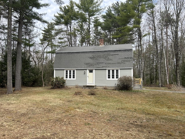 7 Kathryn St, Gorham, ME 04038 - dutch colonial featuring a shingled roof, a chimney, and a front yard