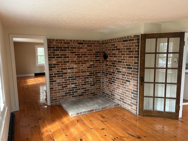 7 Kathryn St, Gorham, ME 04038 - details featuring baseboards, a textured ceiling, and wood finished floors